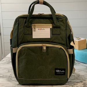 Diaper bag with built in changing pad.